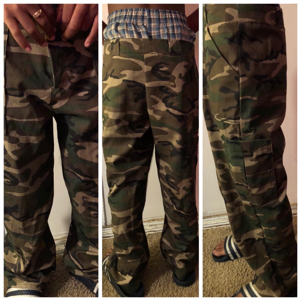 Grade school boy army camouflage trousers.